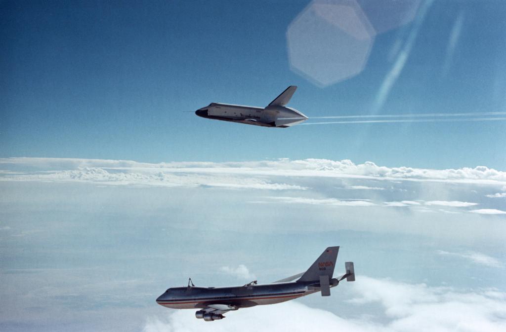 Enterprise soaring above the NASA 747 carrier aircraft on its first free flight. 