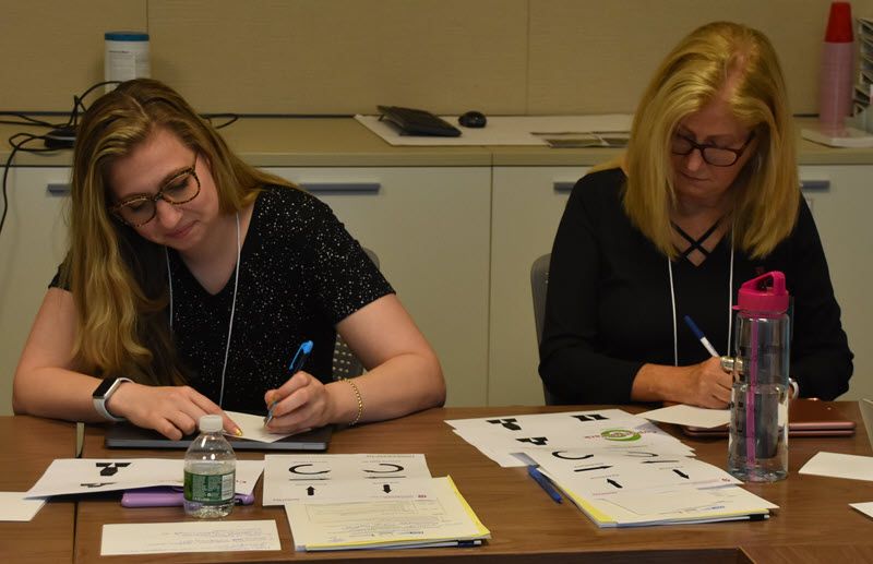 CompSci_EDC's tweet photo. #ComputerScience unplugged! @jenndonais and @EileenBelastock writing cup-stacking instructions for their "robot" friends at Monday's #dlcsambassadors academy. https://t.co/CtiKCSkF5Z
