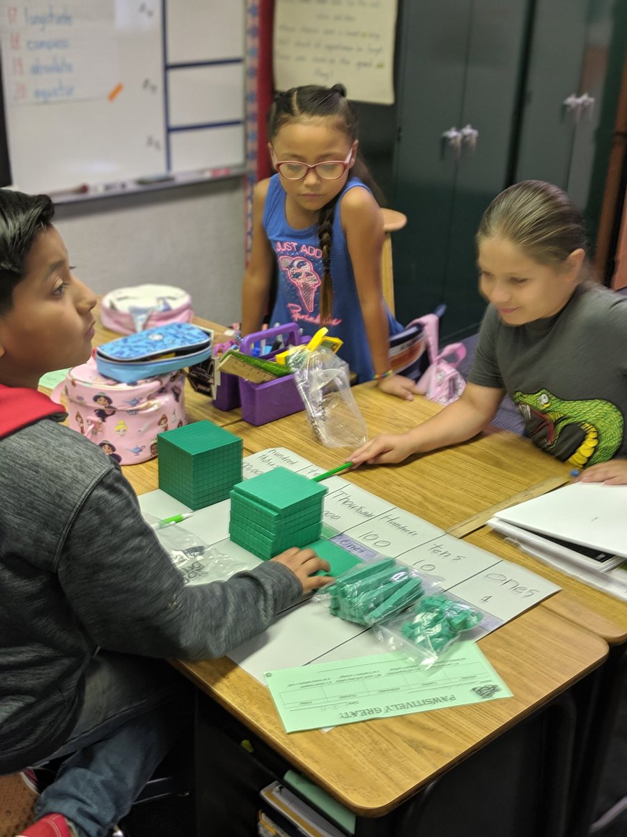 McKinley_CJUSD's tweet photo. Mrs. Gonzales' 4th graders are sharpening their knowledge of place value to break numbers to the hundred thousands in their place value tables. #McKinleyShines #MakingMathAccessible #4thgradeRocks https://t.co/L6QwHhz4Aw