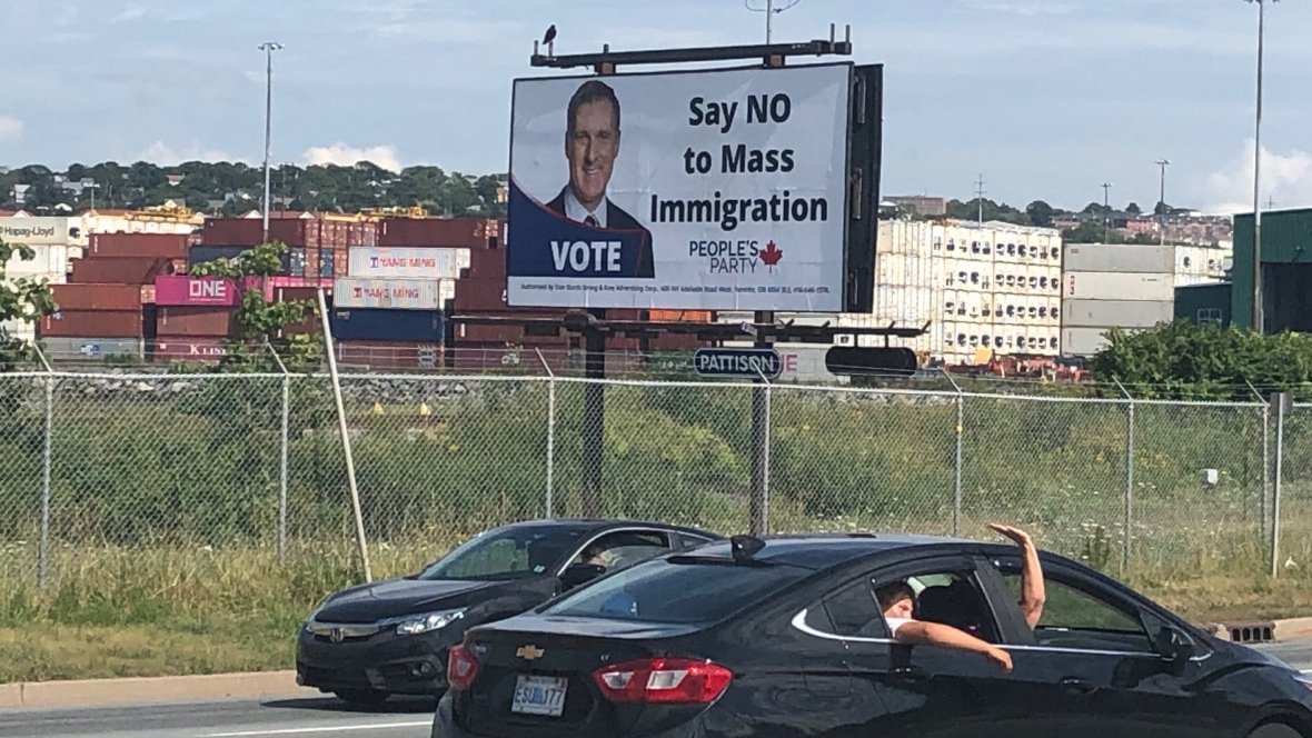 TheCurrentCBC's tweet photo. Good morning! First up today, we’re discussing the removal of billboards telling Canadians to “Say NO to Mass Immigration,” after complaints they were promoting anti-immigrant and racist rhetoric. (Image: Carolyn Ray/CBC) https://t.co/CES3HqPLl5