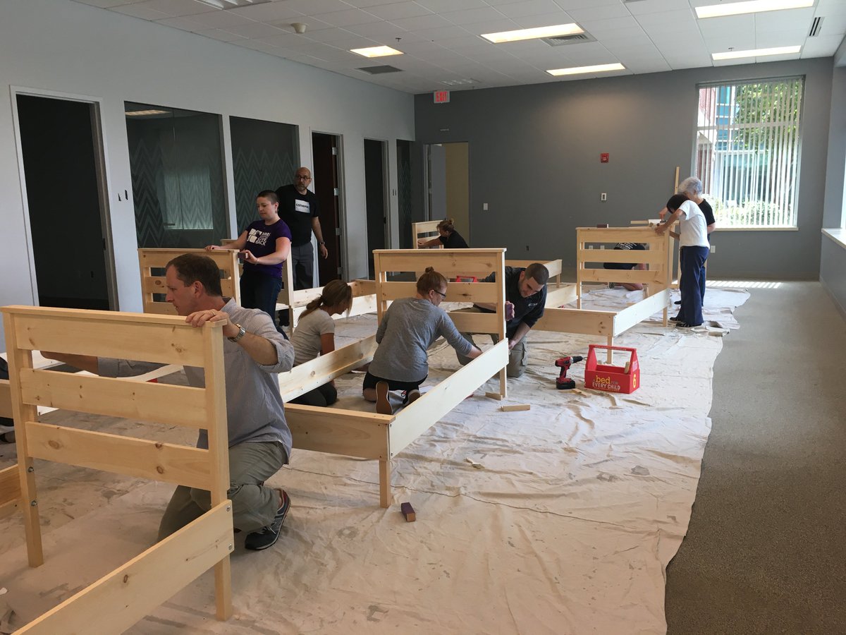 MassMedical's tweet photo. .@MassMedical partnered with @Bed4EveryChild to host an onsite volunteer event for its Build-A-Bed program. 22 employees & family members assembled, sanded, and painted 12 twin beds, to be delivered to children in need across MA, with new mattress and bed linens #MMSGIVESBACK https://t.co/AFOfTK2fCZ