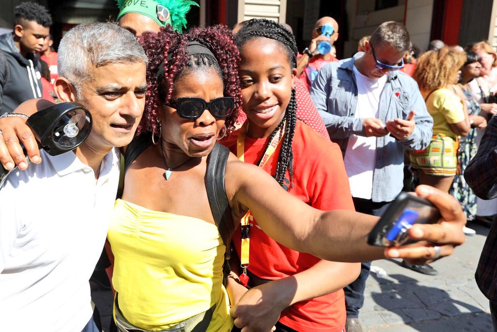 SadiqKhan's tweet photo. Carnival is a celebration of the community, led by the community - and a shining example of what makes London great. The atmosphere is incredible! 

To everyone joining the celebrations - be vigilant, be safe - and have a terrific time.

#NottingHillCarnival https://t.co/wKKb1q7g17