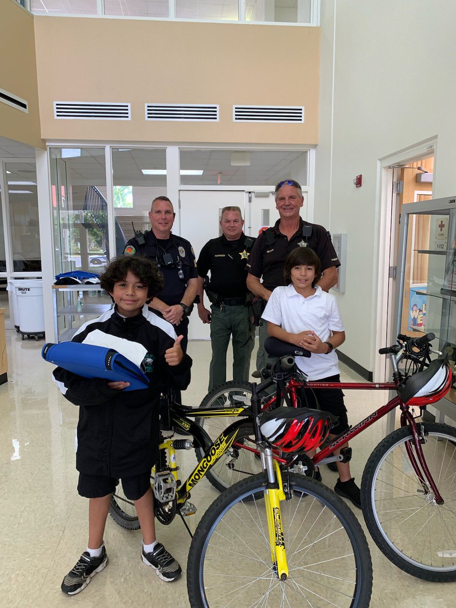 MarcoIslandPD's tweet photo. @CollierSheriff Deputies Nelson and Pschigoda, and Bikes for Tykes and stopped by #MarcoIsland Charter Middle School #micms to donate two bikes to twin brothers. #weprotectparadise #schoolresourceofficer #communitypolicing #colliercounty https://t.co/oHnKTLqWZu