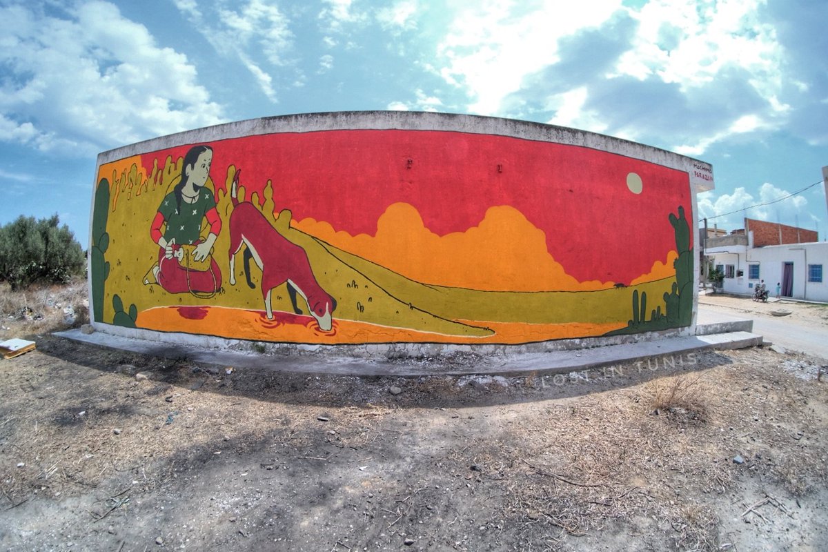 Fhtagn's tweet image. The artists #TARAZA draw giant fresques all around the city of #Tazarka of a Shepherdress looking for her lost sheep.. #Streetart #Tunisia