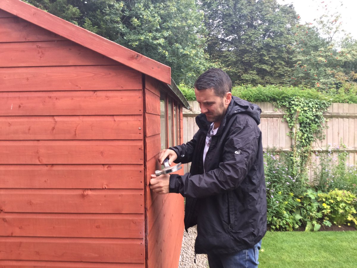 @Paslode_UK #woodworkWednesday #PaslodeUK this is a photo of my son. He has just finishing erecting our wooden shed.