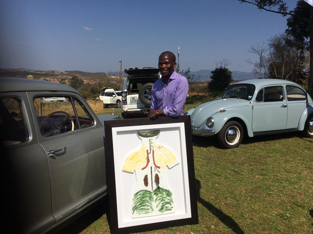 painbytes's tweet image. 17/8/2019 at Kavinga in the LowVeld. Art &amp;amp; Culture by Drs &amp;amp; Therapists. Dr O poses with his ART work. The function raised funds for Medical Care of Vulnerable children.
