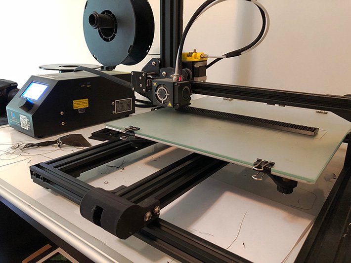 Our 3D printer, printing out a bookbinding  jig