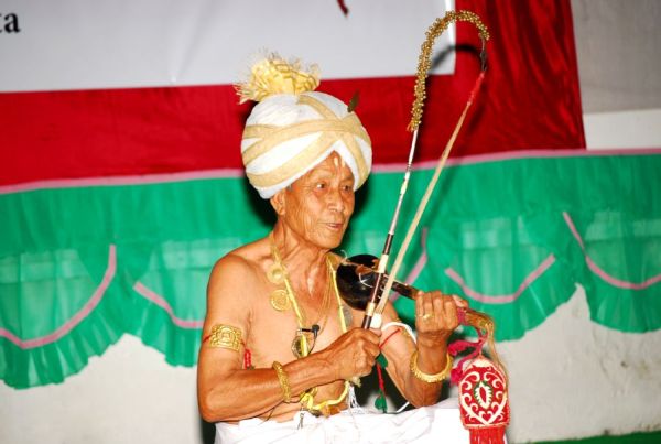 Pena player Manipurtraditional musical instrument of Manipur accompany traditional songs religious rituals & Lai Horaiba dance?