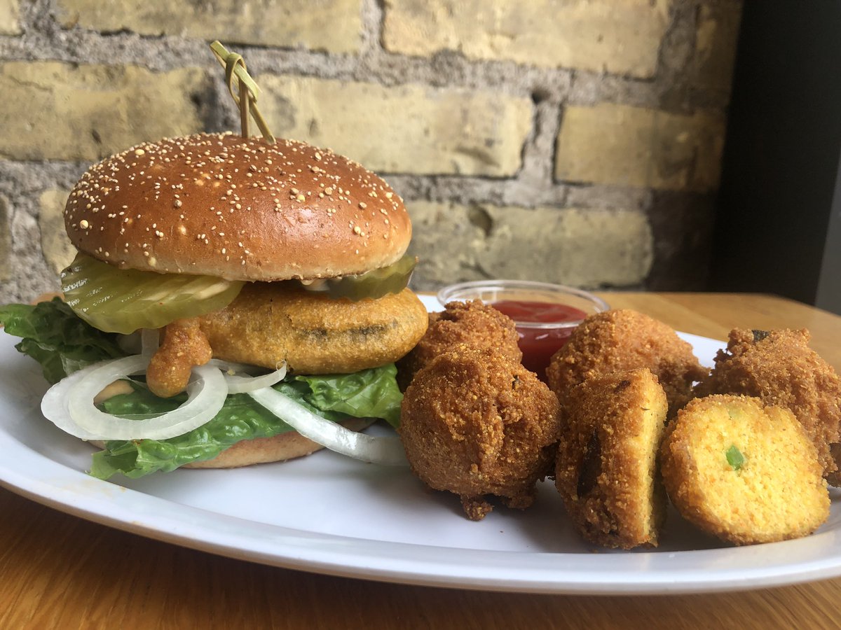 j_selbys's tweet photo. And now serving Fish Faux-let Sandwiches with Hush Puppies! 🐠 Our sandwich of the week will blow you outta the water and it’s #crueltyfreefood! 🌊 Its a fried fish faux-let with tartar sauce, lettuce, onion, and pickle! Served with a side of hushpuppies. #plantbased https://t.co/jHGiKG4yHx