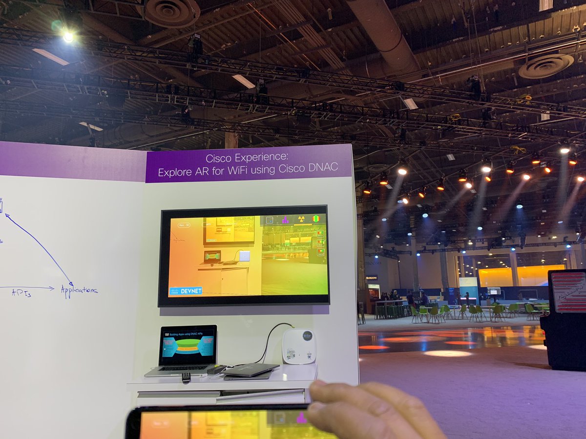 amalegaonkar's tweet photo. Power of DNAC APIs combined with #AR - application that visualizes #WiFi signal and overlay runtime information. Come talk to the #cocreations team in the #DevNet zone, #CiscoIMPACT https://t.co/Gt8hrLqdSF