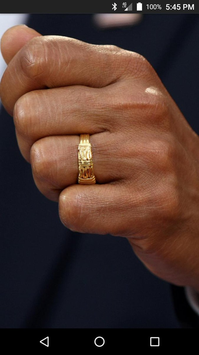 One is said to have an inscription that says... "There is no God but Allah" he was photographed wearing the same ring while in college that he still wears to this day.
