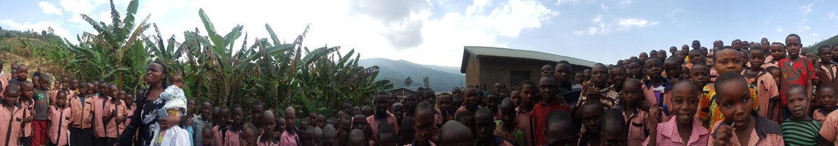 MarieCatalla's tweet photo. After 1hr moto ride and 45mins walk, this is our welcoming committee. The whole school!!!! @ItegureGusoma @VSO_Rwanda https://t.co/NBwUcWi1y3