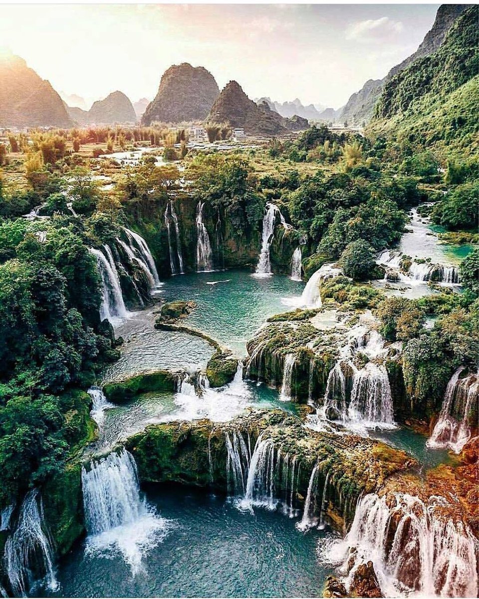 And that’s how we do waterfalls in #Vietnam 🇻🇳 The remarkable Bản Giốc waterfalls in Cao Bằng province are the ultimate destination for adventurous travellers. 
#waterfall #waterfalls
#GreenlandPurchase #nature 
#naturelovers 
#travel 
#travelphotography 
#travelbloggers