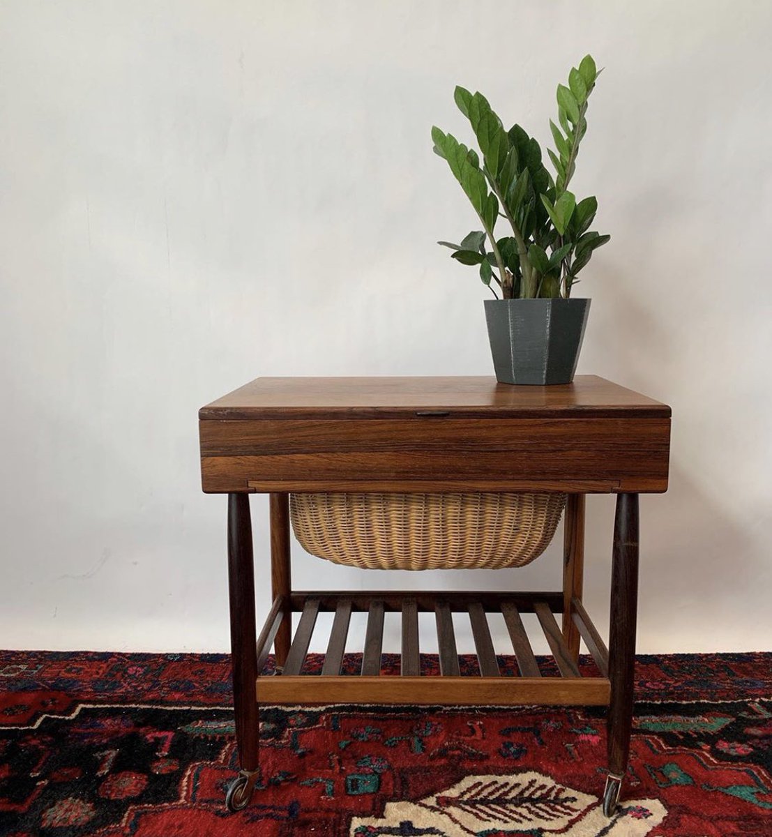 PeriodModern's tweet photo. Available: Wonderful Rosewood Sewing Table by Ejvind Johansson circa 1960s. The top opens up to interior compartmentalized storage, while the lower shelf allows access to a built-in basket. Unique option for a cabinet, bedside table or jewelry storage. #ejvindjohansson #sewing https://t.co/HgCLsI8PpT