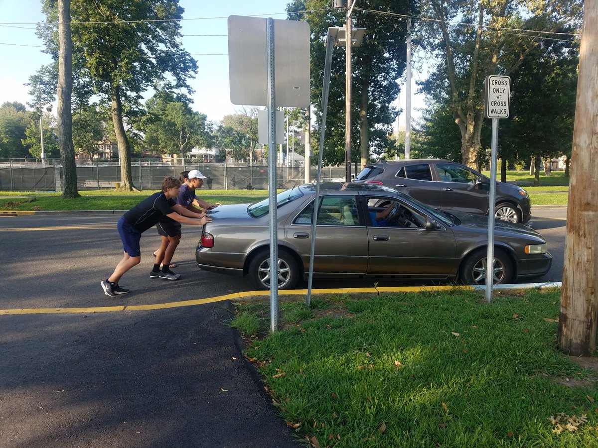 WeehawkenXCTF's tweet photo. Cameron Hinton, Collin Shevlin, and Coach Jay giving a hand to a North Bergen resident this morning during practice https://t.co/gZ2tC9hSLr