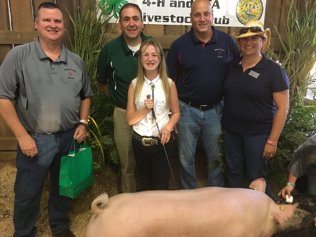 wetzelcs's tweet photo. WCS staff Darren Cook, Ed Toman, Amanda McPherson, and Board Member Brian Price pose with the market hog purchased by WCS. https://t.co/iJiZ4DKii9