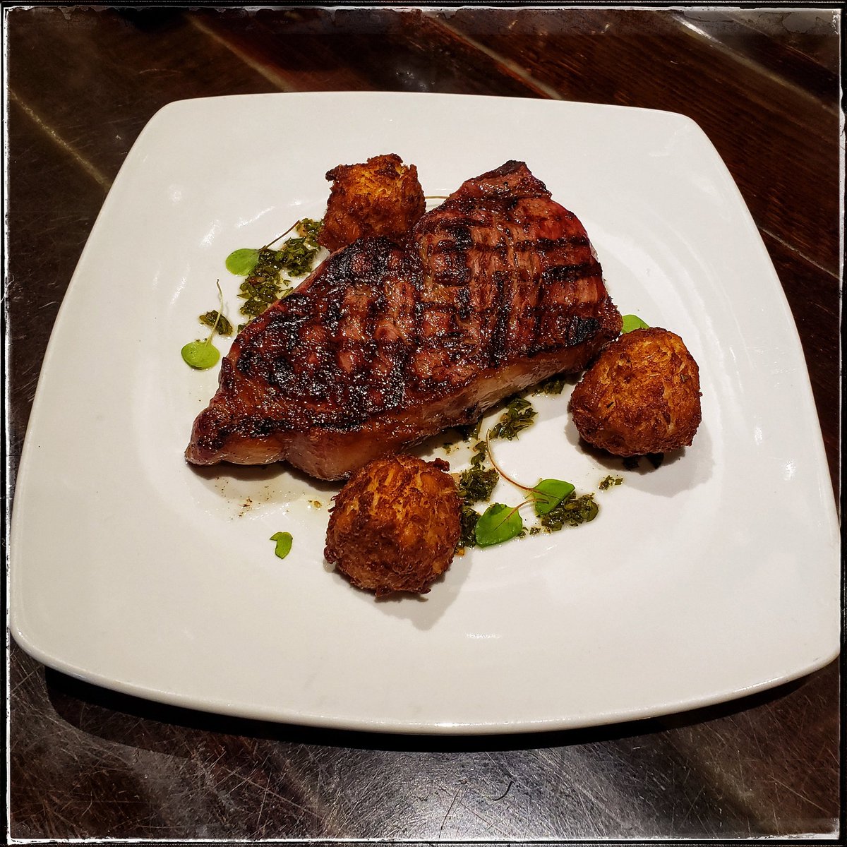 tweetBrokenBit's tweet photo. Come and surf on our turf! Prime Dry Aged New York Surf &amp; Turf $59- 3 Fried Crab cakes, Chimichurri, Choice of Side. Call 661-943-8228 or click here for reservations https://t.co/C8GFDh0fCg #BrokenBitSteakhouse #AVSteakhouse  #NewYorkSteak #DryAged #CrabCakes #chimichurri https://t.co/fDsIG4cOXE