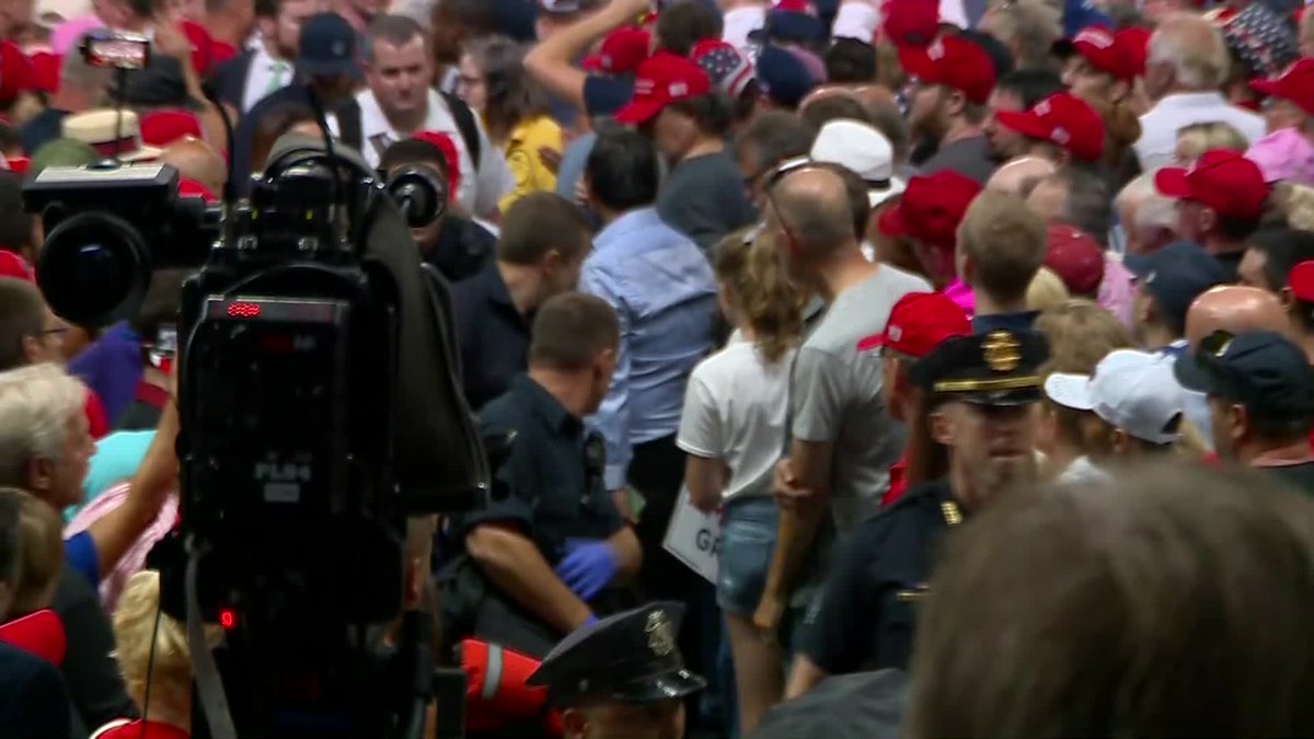 WCVB's tweet image. Brief pause from @RealDonaldTrump at #TrumpinNH rally for police, paramedics to assist woman who appeared to have some kind of medical emergency.