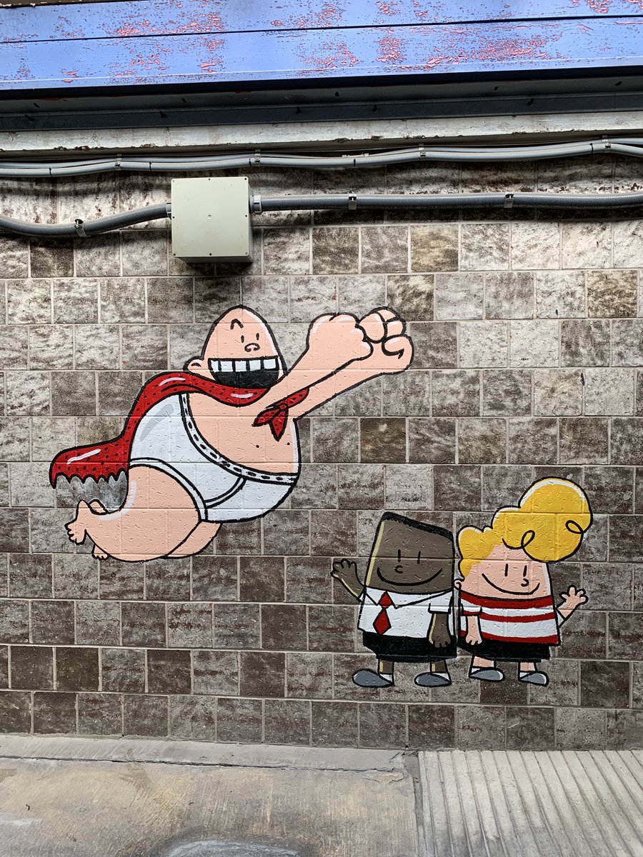 TBradleyMurals's tweet photo. Another morning @PetersenHISD .... check out Captain Underpants!!! So thankful to have extra help this summer. This is Montana working on the Captain Underpants characters. I feel like I’ve literally thrown her into the fire this summer!!! 🔥 https://t.co/91ekpzAWSQ
