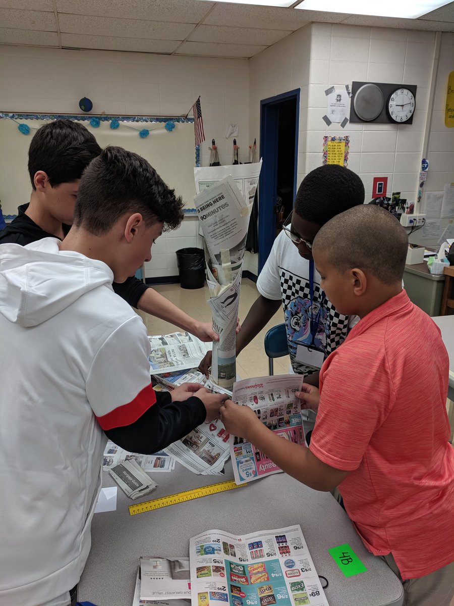 stratmanscience's tweet photo. Breaking the ice with home base in a friendly newspaper tower competition.  What a collaborative and creative group! #jjh68learns https://t.co/zlXyNQgENg