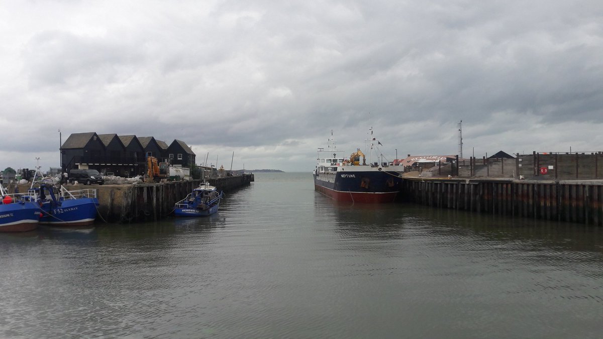 A gloomy but busy Whitstable harbour and yacht club area...