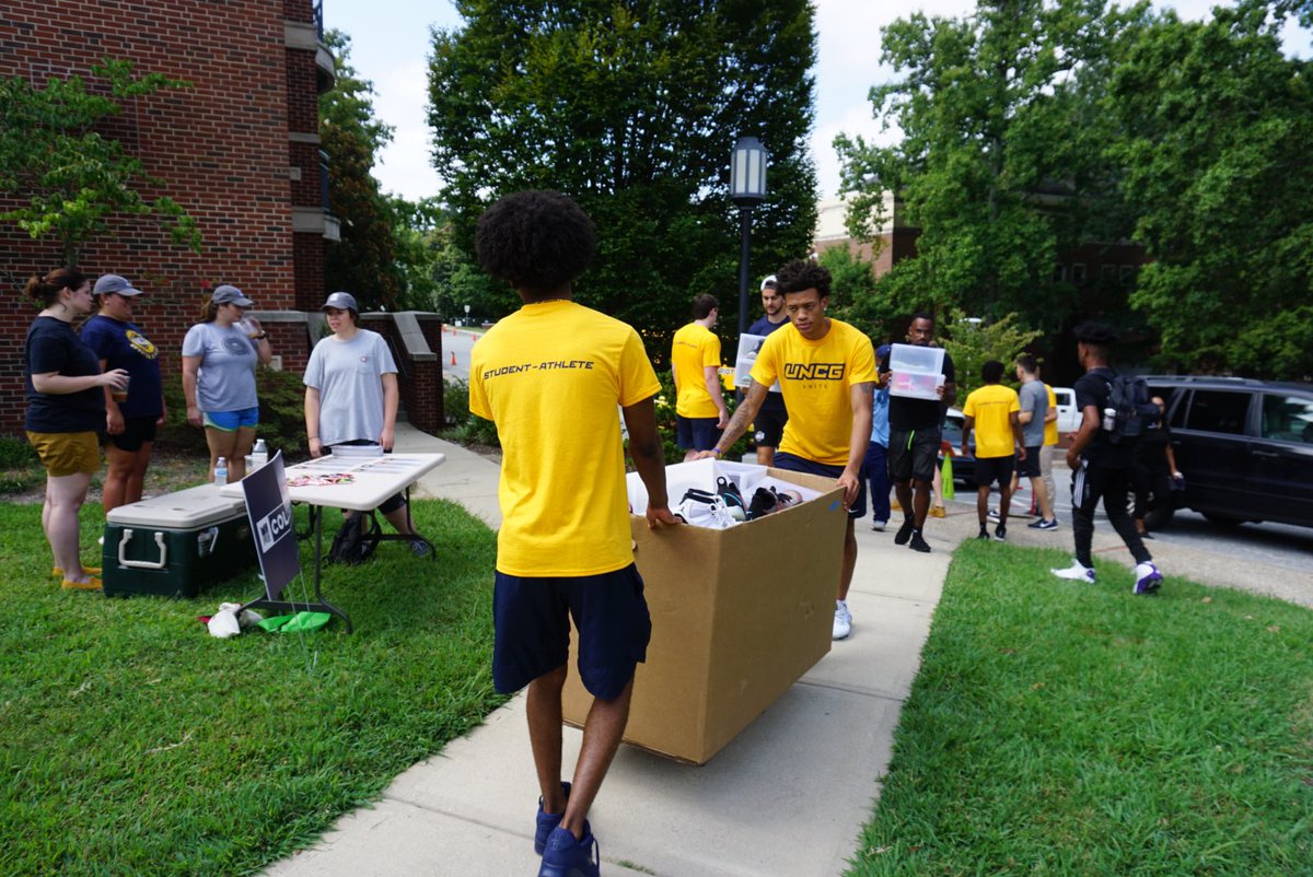 UNCG_SASS's tweet photo. Some @UNCGBasketball student-athletes braved the midday heat to help out too!!! #movecrew #movein #letsgoG https://t.co/31oL8WTv5X