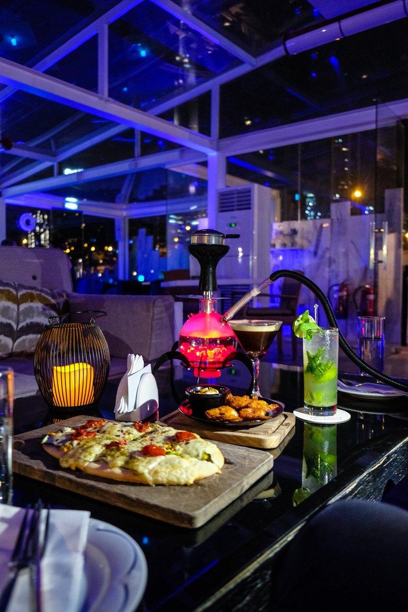 DusitThaniDubai's tweet photo. Summer-ready #ViewbyDusit awaits you and the gang.
Open daily, 6pm to 2am.
#shisha #drinks menu by @jonesthegrocer
Photo by @DubaiTravelBlog https://t.co/1KWTdtpAvK