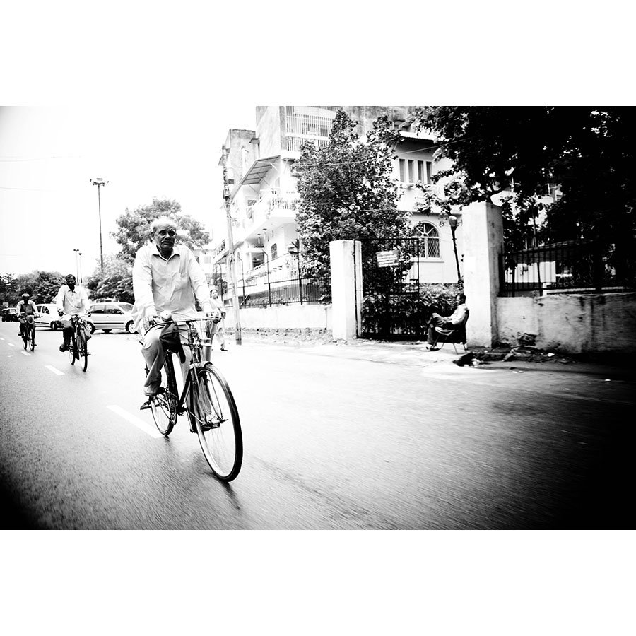 Bicycles are crucial part of life in Dehli streets. On this particular route, one can find a notable statue of Mahatma Gandhi on view for avid peddlers.