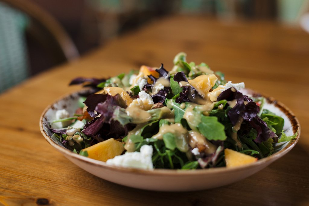 Peaches are delicious on their own, in cobbler, and yes, even on salad. Don't quite believe us? We can prove it 😉