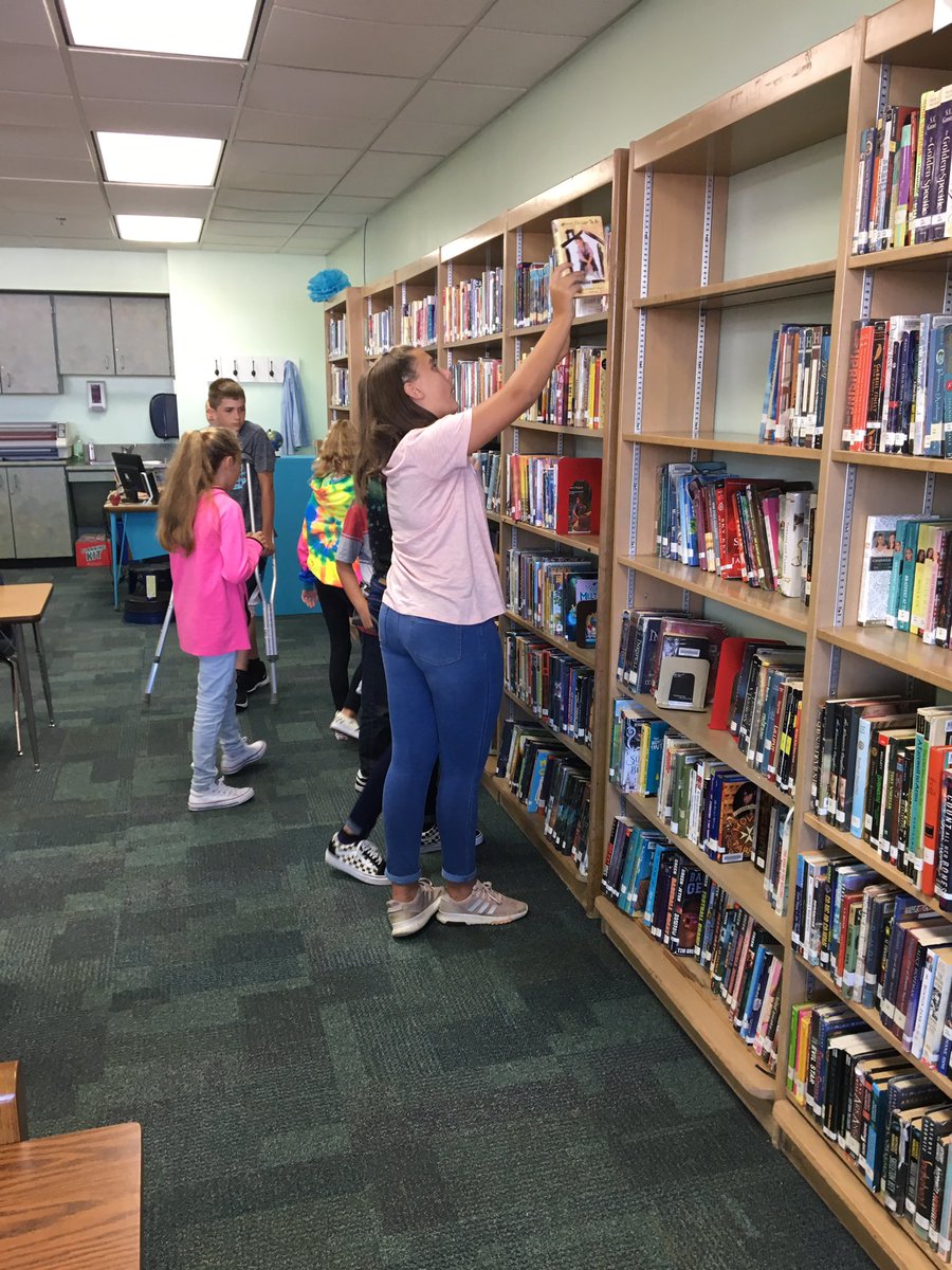 NR_KJones's tweet photo. We are excited to check out books at our *new* MS library! So many titles, so little time! @NRMiddleSchool #WeAreNR #bookworms https://t.co/Hj9qDkY9oD