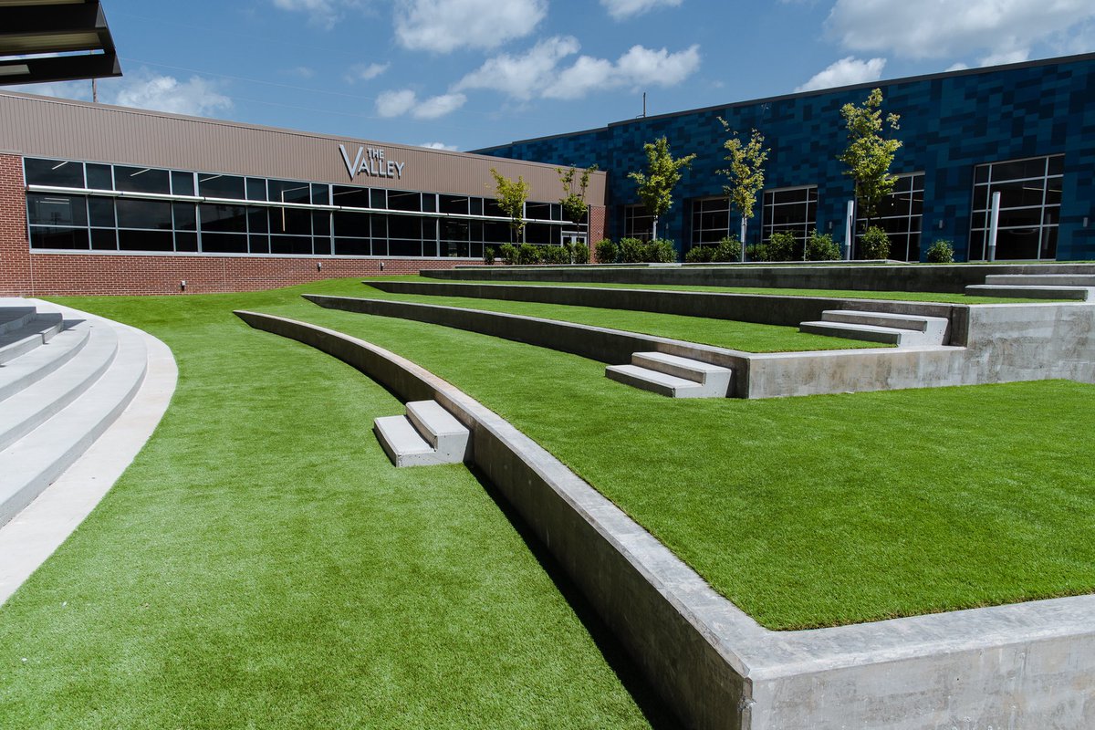 Turfetc's tweet image. Grain Valley High School Seating Terrace Courtyard turned out so beautiful! This is SYNLawn artificial grass. Do you have an area almost impossible to get a mower to? Call us at 816-886-2747 for your free estimate. @synlawn #landscapedesign #landscape