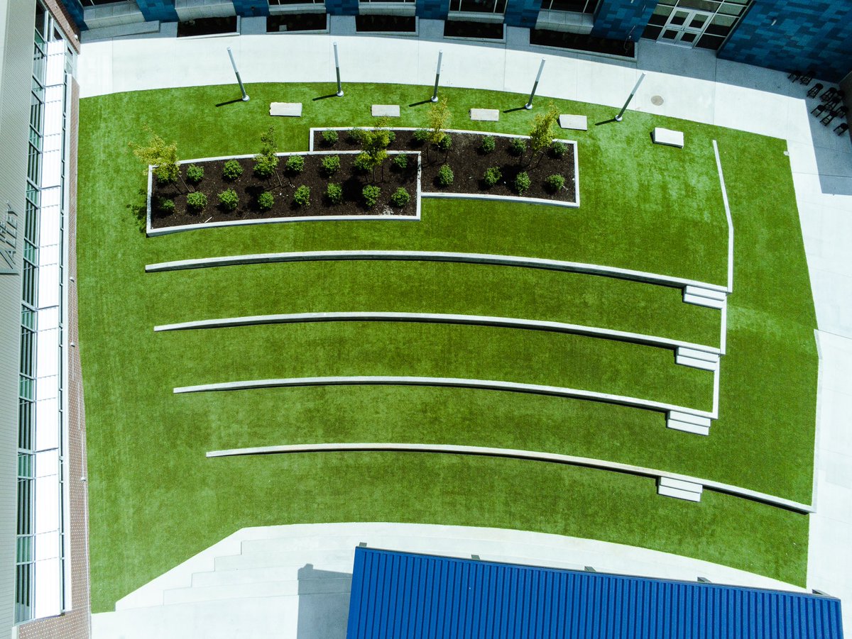 Turfetc's tweet image. Grain Valley High School Seating Terrace Courtyard turned out so beautiful! This is SYNLawn artificial grass. Do you have an area almost impossible to get a mower to? Call us at 816-886-2747 for your free estimate. @synlawn #landscapedesign #landscape
