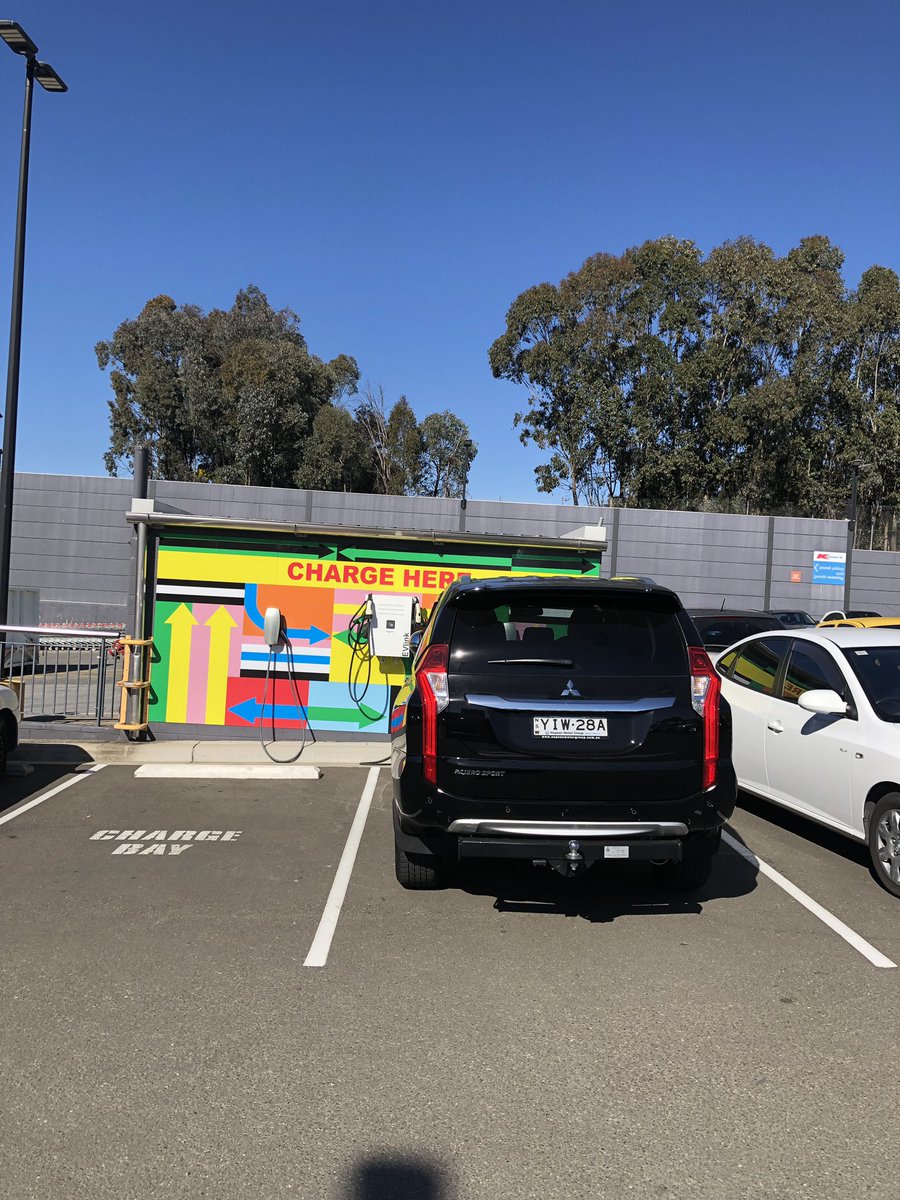 oztesla's tweet photo. This just happened in front of my eyes! ICE parked in EV spot! I hope people will be educated soon on this one! https://t.co/pEYmT39pnK