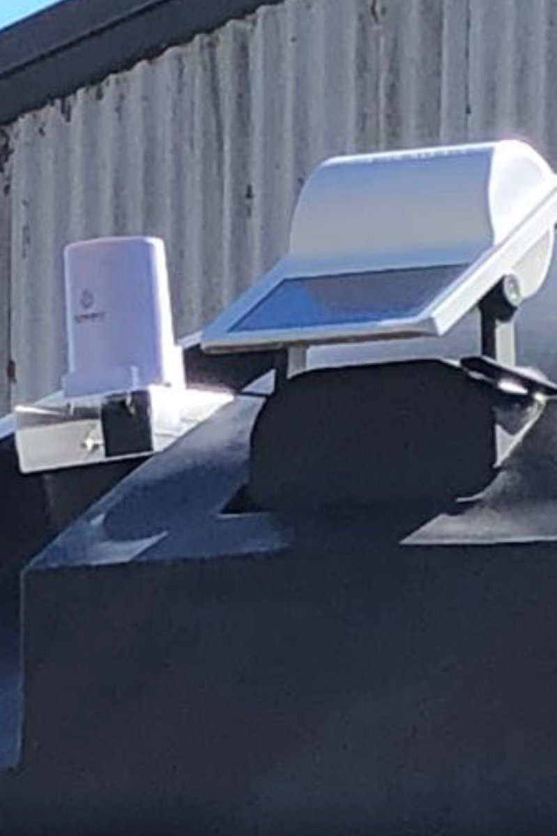 Coppo's tweet photo. Hmmmm...there’s something shiny and new on the tank at Farmbot’s secret testing facility!?! Snuck in and got this exclusive photo with my telephoto lens.... #agtech #farmbot #topsecret #iot https://t.co/HMYENbyLxx