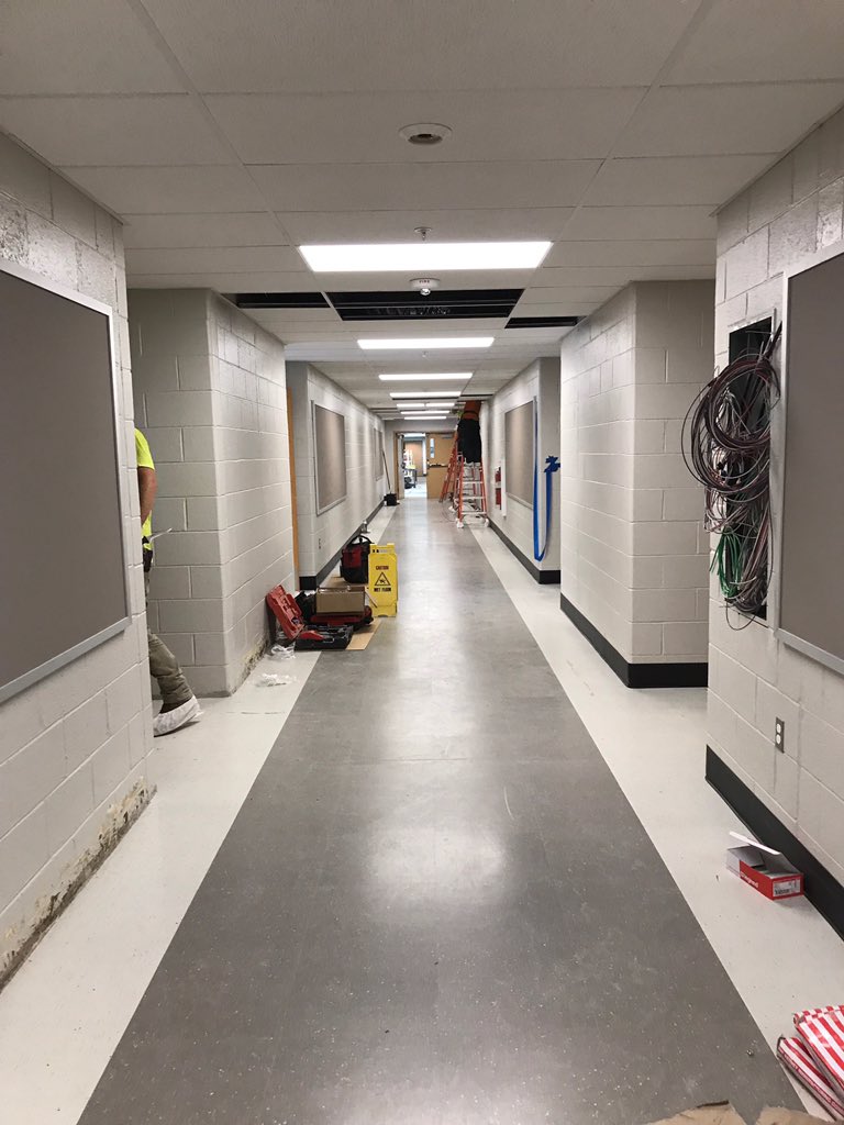 culbertson_mnsd's tweet photo. Desks, chairs and cabinets are being returned to the classroom.  All classrooms have a cork board located outside of the rooms in the hallway. New floors look great!  The new bus loop is also taking shape. @MarpleNewtownSD https://t.co/Tb83iMeZWE