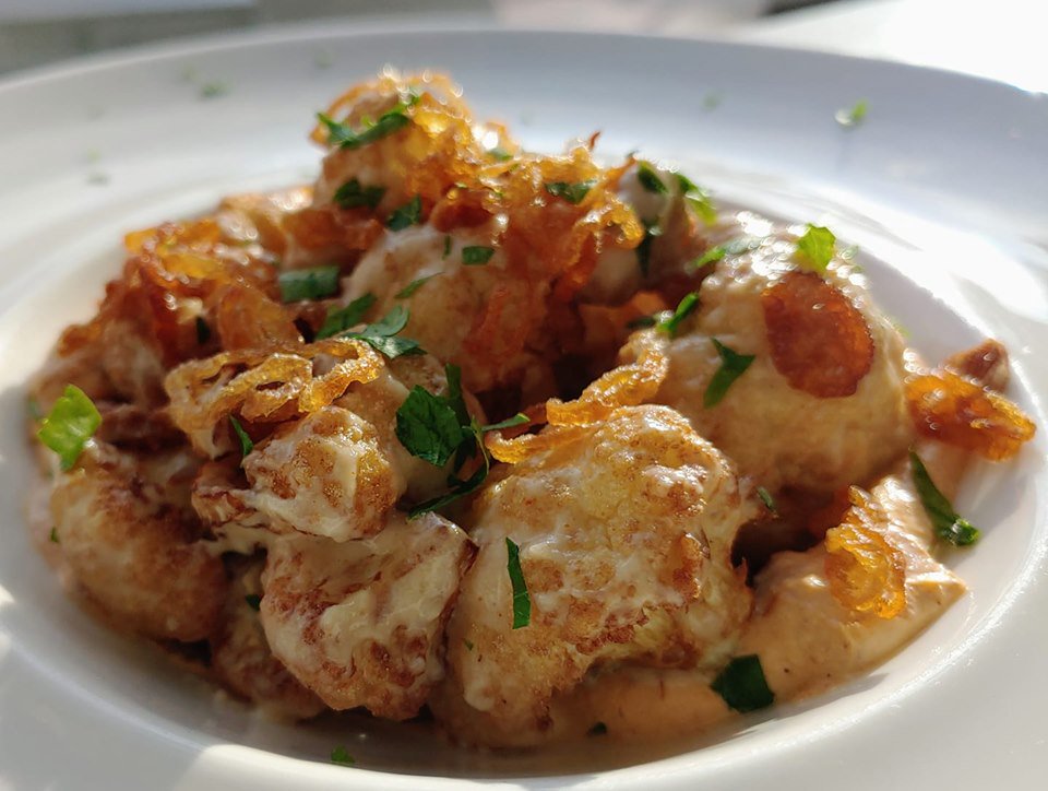 Fried Cauliflower - Tahini/Aleppo pepper yogurt/crispy shallots/fresh herbs. 

#portlandmaine #wineanddine
#vegetarian