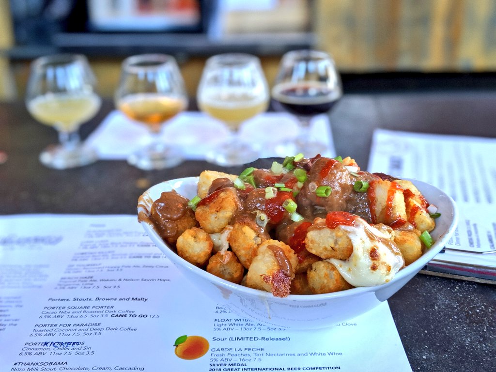 SidewalkSafari's tweet photo. Sampling #craftbeer and comfort food (spicy poutine tater tots) at @Slumbrew #slumbrew. If I haven't taken the early flight, I would have missed this 😋 https://t.co/5Q5PT2MFjD