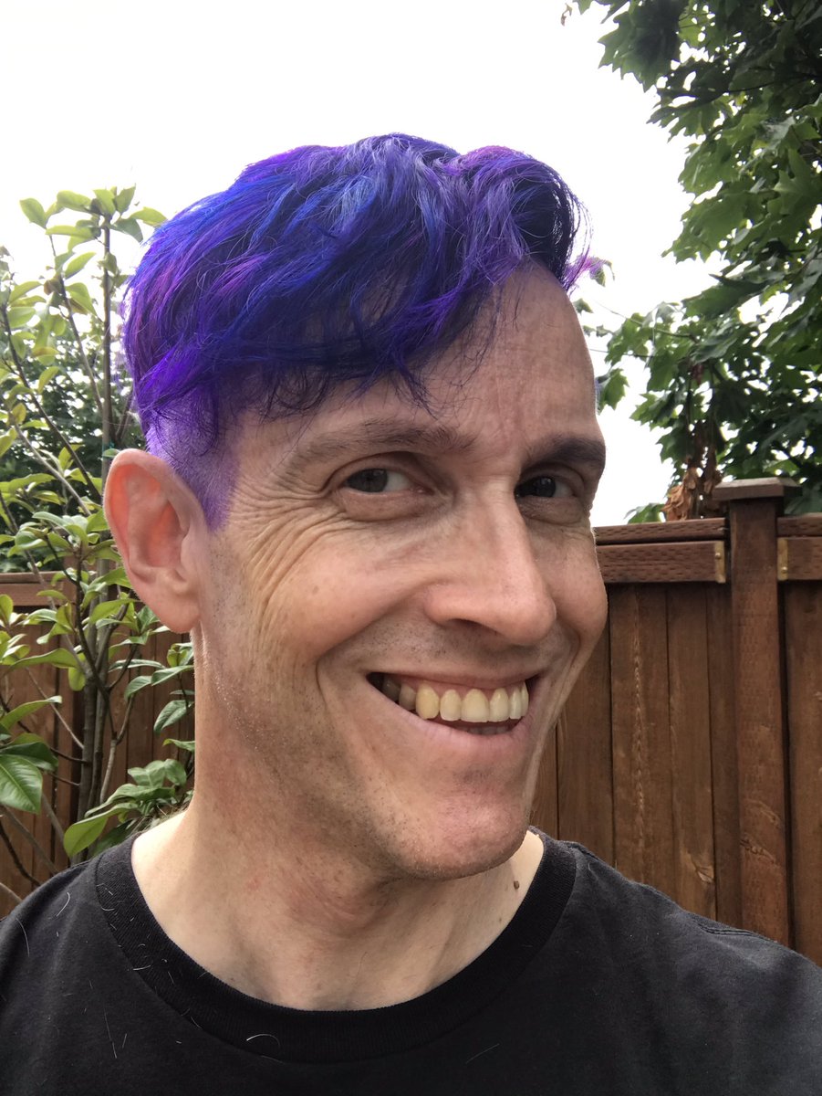JamesCStewartNZ's tweet photo. I decided I wanted to change things up before going to #BurningMan next week, so this happened today! Huge thanks to Natalie Caprica Brookes at Kismet Salon for the awesome new cut &amp; color! #powerviolet https://t.co/iavfTHd4Zw