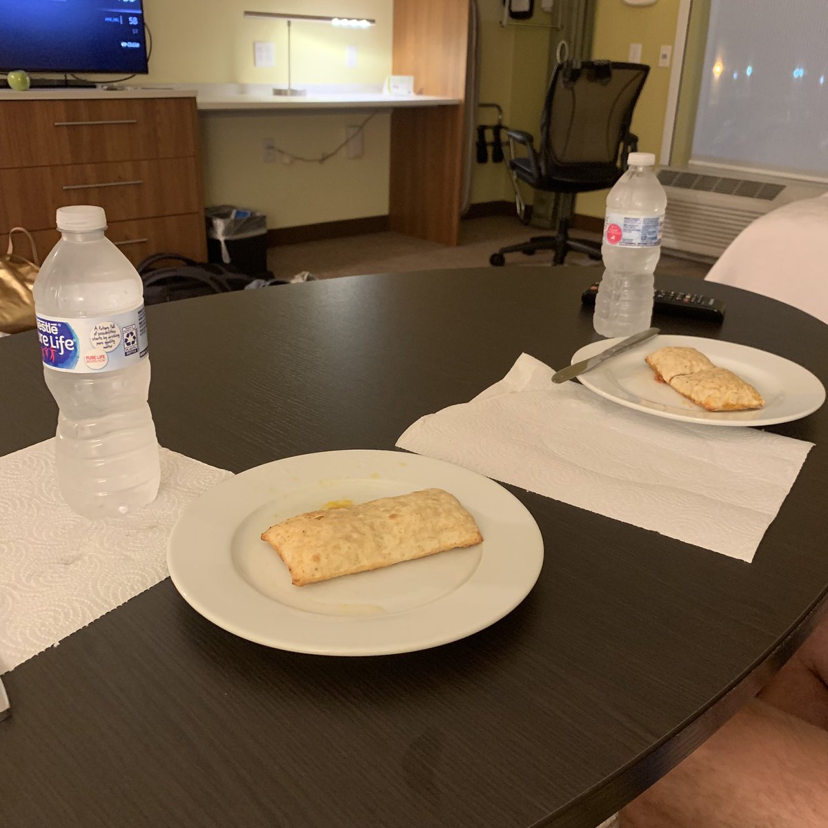 ereib's tweet photo. Instead of sleeping in our own bed, Steve and I are eating @hotpockets in a hotel room that we will get to sleep in for about three hours (and that we get to pay for). Thanks for nothing, @AmericanAir #AmericanAirlines #flightfail https://t.co/0wSJRNf3bH