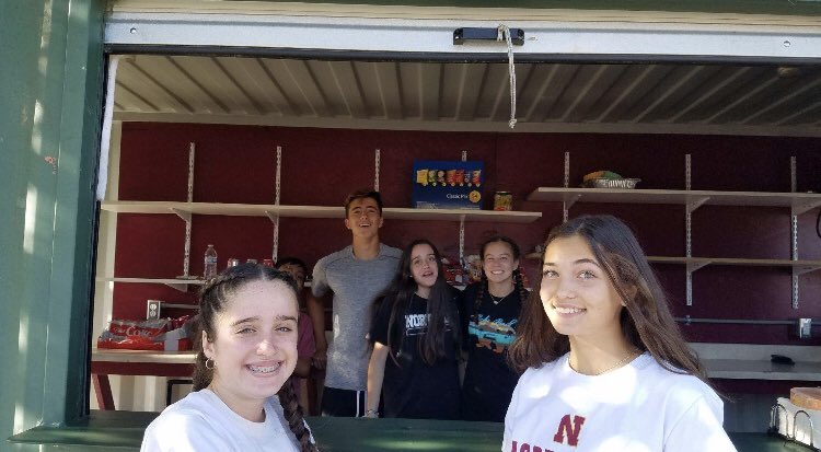ngwsoccer's tweet photo. @ngsoccer boys, siblings, significant others working the @nhsbroncos football scrimmage to fundraise the boys program. Setting the standard for @ngwsoccer turn in late October. @NorthgateHS #Broncofamily https://t.co/l6vxNtdKba