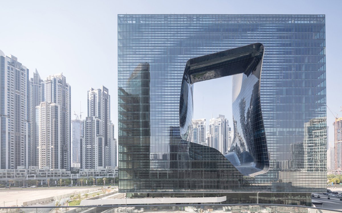 #Opus in Dubai #ZahaHadidArchitects mixed-use #building formed of conjoined #towers irregular #void in middle #Hotelinteriors for ME Dubai hotel are currently being fitted out, scheduled opening in 2020. Two glazed adjacent 100-metre #hightowers #cubeshape dezeen.com/2019/08/13/opu…
