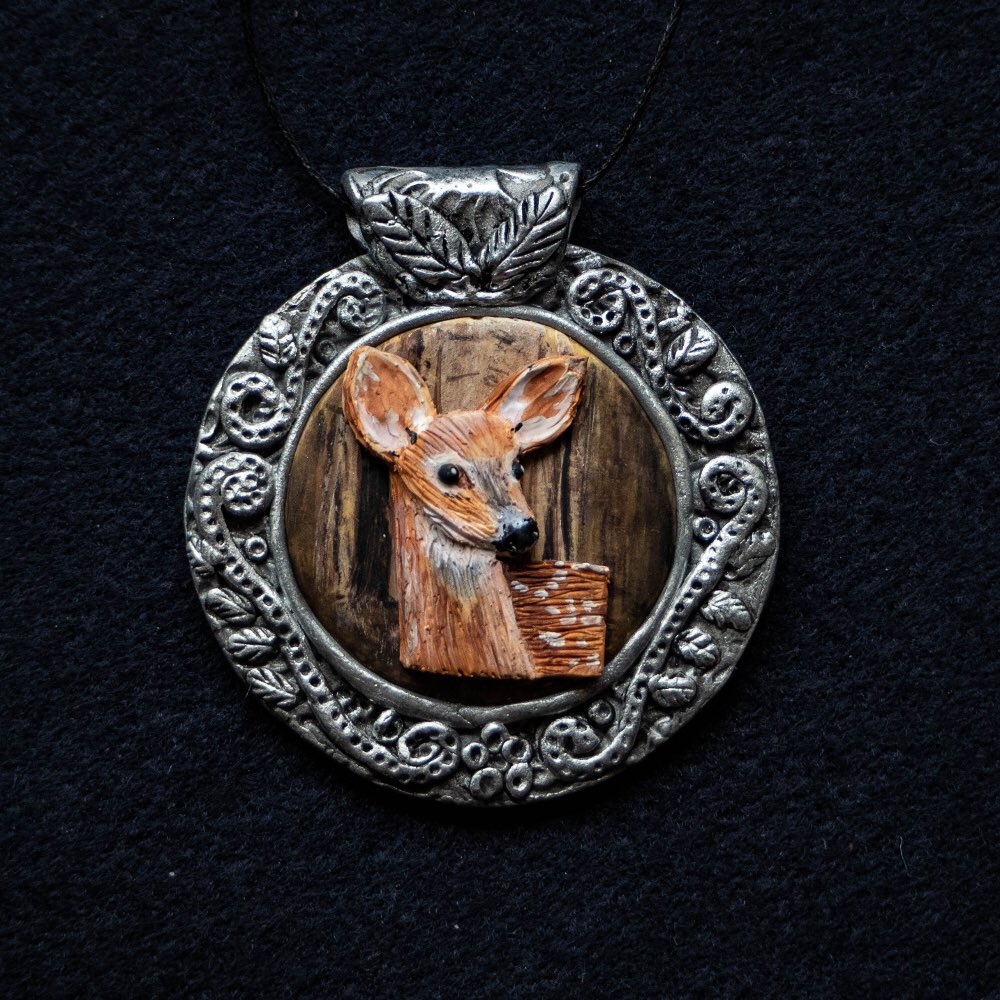 One of my latest creations. Pendant depicting a deer. Faux silver #polymerclay #ArtistOnTwitter #deer #wildlife #jewelrydesigner @deersociety #oneofakind @Staedtler #fimo #acrylicpainting #bohochic @SculpeyPolyform . Used #fimo and prem sculpey.