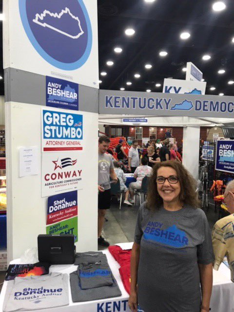 KyDems's tweet photo. We may be Kentucky Democrats, but we have republicans visit our booth all the time at the #KYStateFair. That includes Terry, a Taylor County teacher and registered republican, who’s not only voting for @AndyBeshearKY, she bought his shirt too! https://t.co/1IbExJXbvI