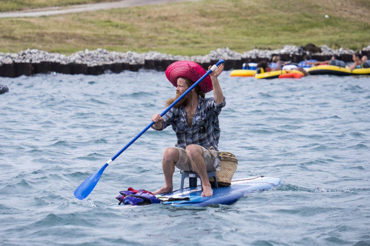 bmwellsphoto's tweet image. I’m ending my #FloatDown tweets with just a few more frames, including one of @PortHuronFire Firefighter Steve Didocha helping to tow a group of floaters on what appears to be a floating picnic table with a Tiki-style roof towards the U.S. shoreline (fourth photo).