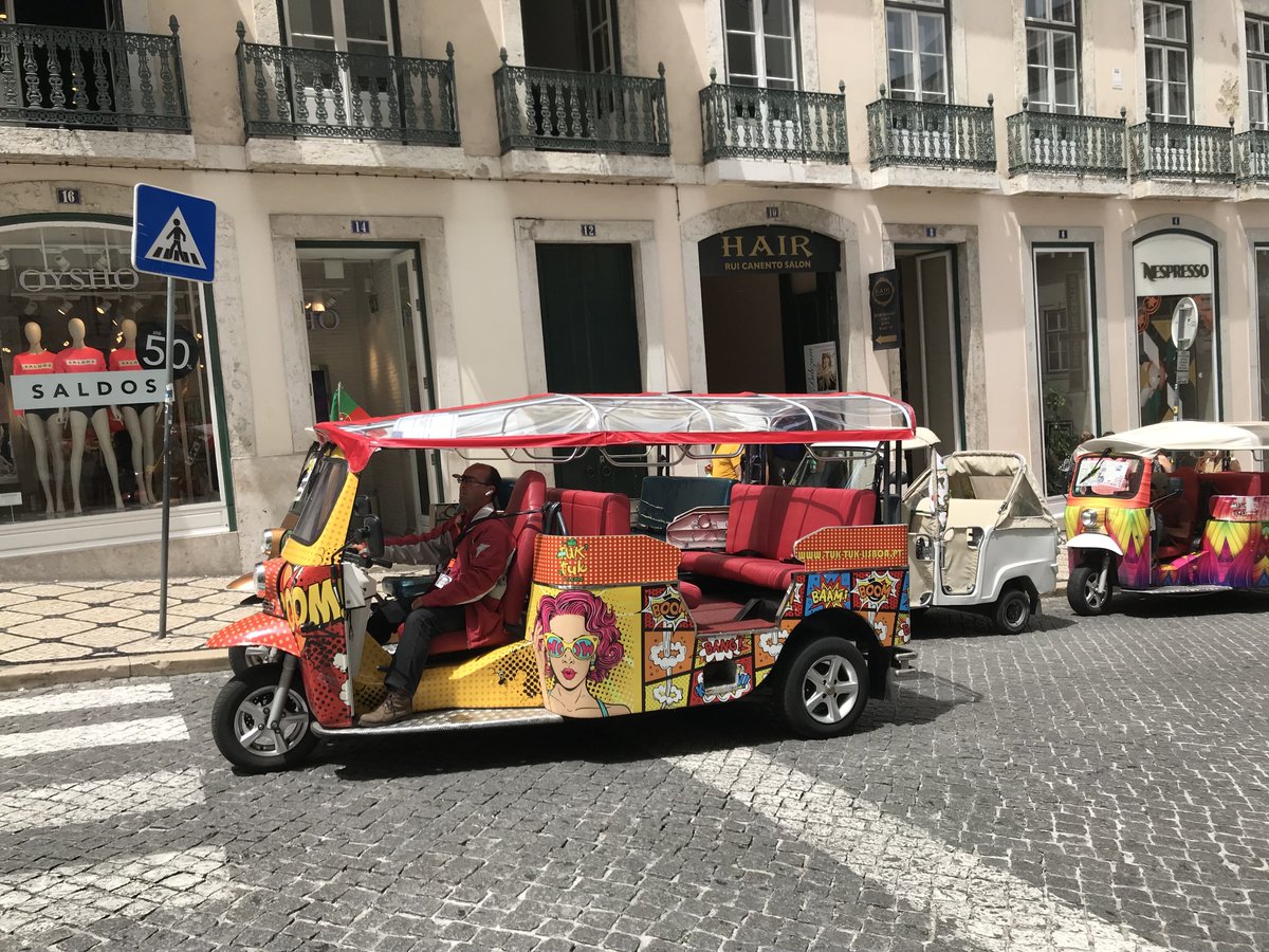 Textar_UK_IRL's tweet photo. We spotted an interesting vehicle, which takes you on a #citytrip around #Lisbon. The Tuk Tuks are environmentally friendly, driving fully electric and are definitely an eye-catcher, don't you think? #electricvehicle #vacationmode #textar https://t.co/hp0iK2Bo2T