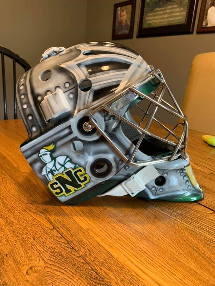 theSJHL's tweet photo. New goalie mask for former @Milshockey goalie Colby Entz, who's off to @stnorbert this Fall.  Painted by Rita Swanson and clear coat by Perception Autobody. https://t.co/UfaBw3Y0kh