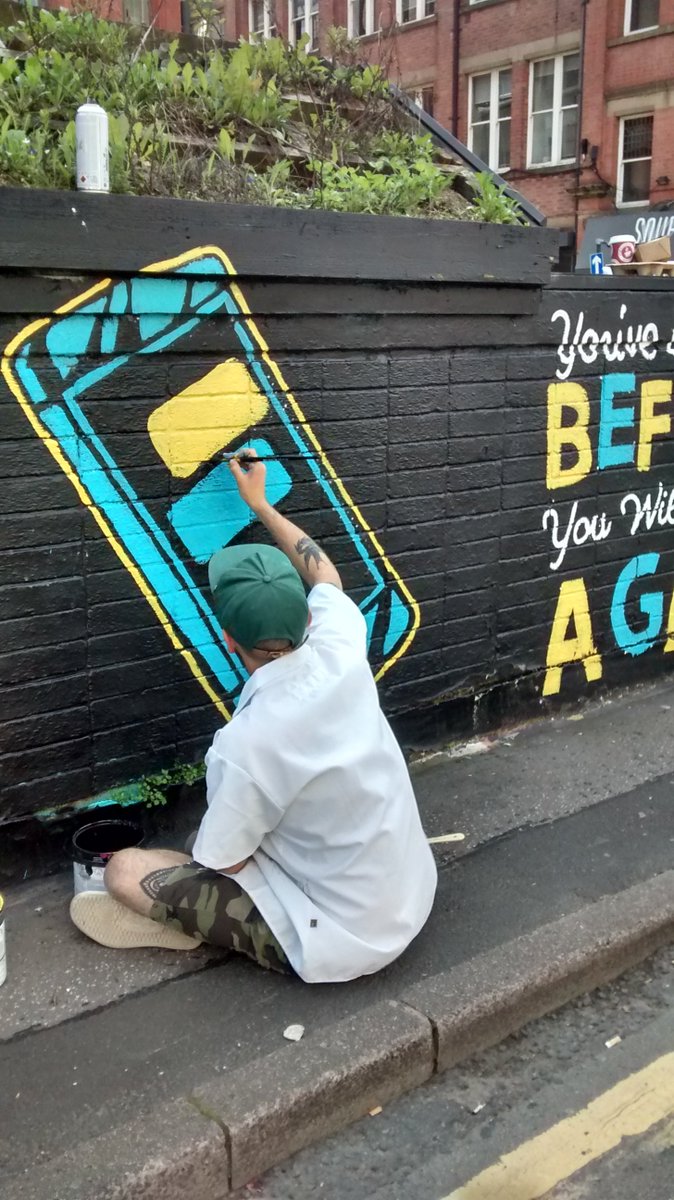 PublicMtg's tweet photo. Local artists at work this weekend in Stevie Square - @graffiti_russ painting a design by @beckystrick, @carolinedowsett, @_AhoyThere at @outhousemcr #Manchester You can checkout Harrison's @_AhoyThere exhibition @idlehandscoffee just round the corner! #BeKind #FreeAhmed https://t.co/AauS8Og0kz
