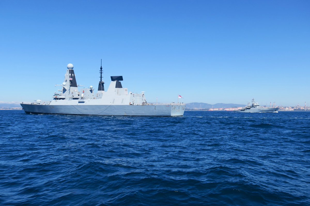 RNGibSqn's tweet photo. A busy day for the @RoyalNavy in Gibraltar as we wished @HMSDefender fair winds on her deployment, and offered a warm welcome to @HMSEnterprise. @RNGibSqn and #GDP were on hand to offer force protection to both visitors. #Defendendovinco #spesasperalevat #boldlygo https://t.co/wVaQ7VVIsl