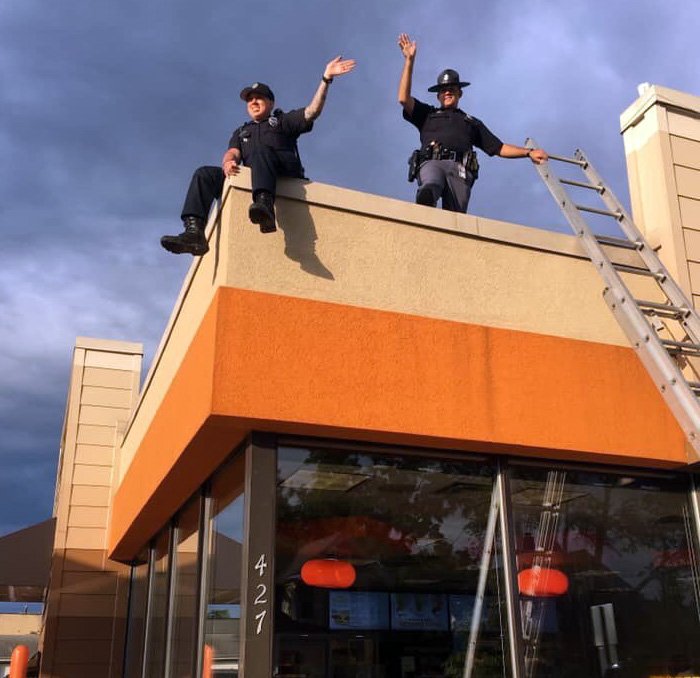WisconsinDOT's tweet photo. ICYMI: State Patrol participated Friday in the annual #CopsOnARooftop fundraiser for @SpecialOlympics Wisconsin. A sweet way to help. @dunkindonuts https://t.co/K511jMJbvX