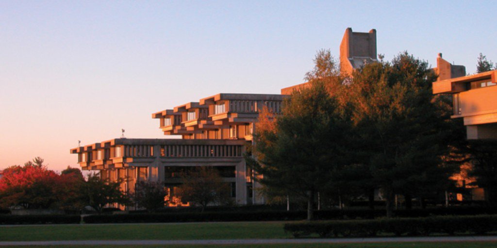 UMassDGSSP's tweet photo. Time to find that perfect shot...Happy #WorldPhotographyDay! UMassD's unique architecture can lead to some really stunning  photos, especially at sunset! https://t.co/307AQj3e0z